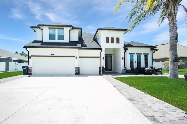 95353 Orchid Blossom Trl, Fernandina Beach, FL 32034 - view of front of home featuring concrete driveway, a garage, and stone siding