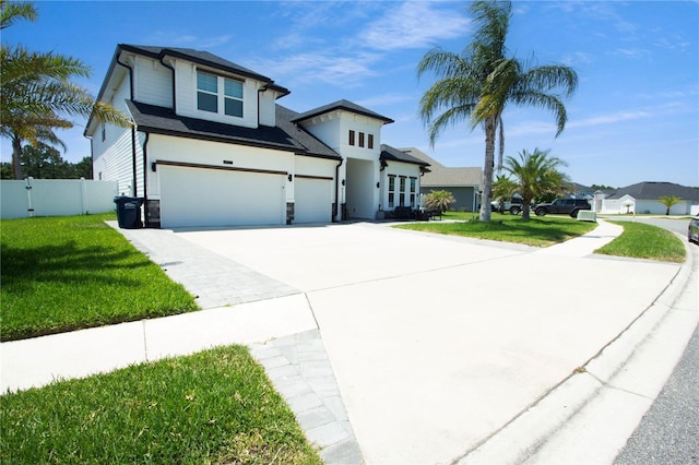 95353 Orchid Blossom Trl, Fernandina Beach, FL 32034 - view of front of property featuring a garage, concrete driveway, and stone siding
