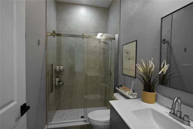 95353 Orchid Blossom Trl, Fernandina Beach, FL 32034 - bathroom featuring vanity, a stall shower, and toilet