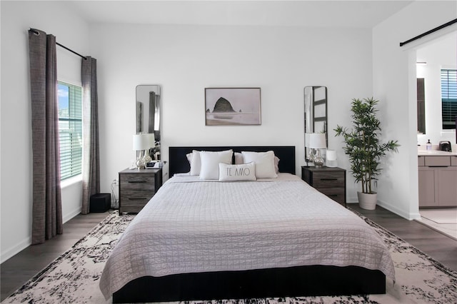 95353 Orchid Blossom Trl, Fernandina Beach, FL 32034 - bedroom with multiple windows, light wood finished floors, and ensuite bath