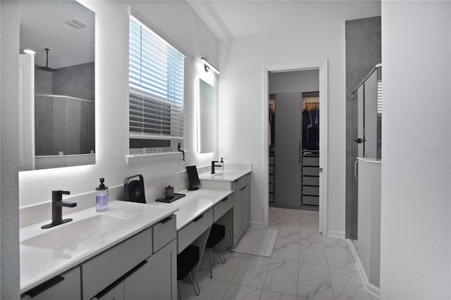 95353 Orchid Blossom Trl, Fernandina Beach, FL 32034 - full bath with marble finish floors, a stall shower, vanity, a walk in closet, and baseboards