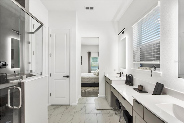 95353 Orchid Blossom Trl, Fernandina Beach, FL 32034 - bathroom with marble look tiles, double vanity, connected bathroom, a stall shower, and baseboards