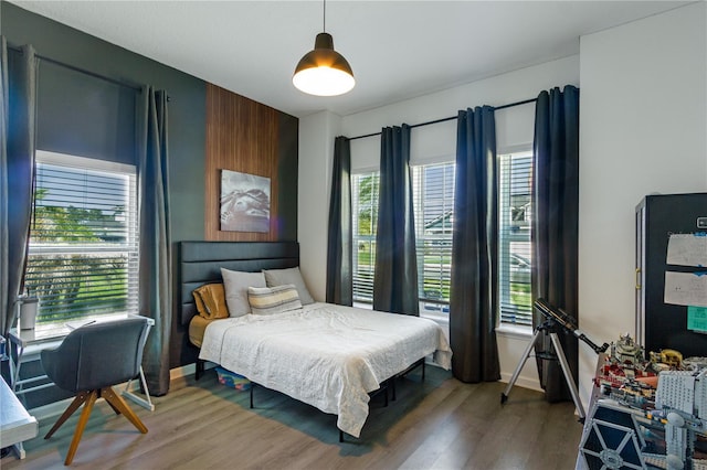 95353 Orchid Blossom Trl, Fernandina Beach, FL 32034 - bedroom featuring light wood-style floors and baseboards