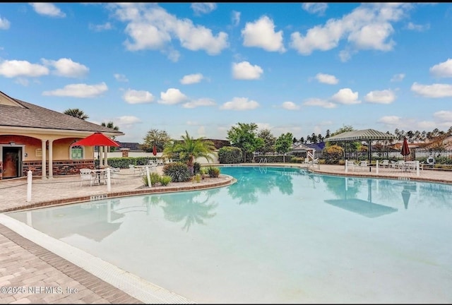95353 Orchid Blossom Trl, Fernandina Beach, FL 32034 - community pool with a gazebo and a patio