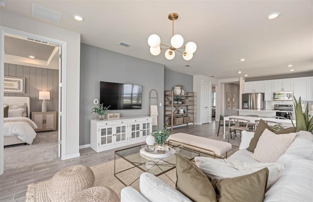 1811 Spring Shower Cir, Kissimmee, FL 34744 - living room featuring light wood finished floors, baseboards, a chandelier, and recessed lighting