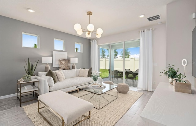 1811 Spring Shower Cir, Kissimmee, FL 34744 - living area featuring plenty of natural light, a chandelier, light wood-type flooring, and recessed lighting
