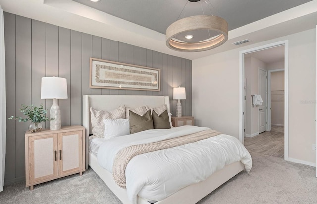 1811 Spring Shower Cir, Kissimmee, FL 34744 - bedroom with light carpet, a tray ceiling, and baseboards