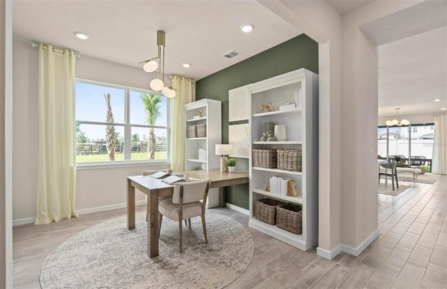1811 Spring Shower Cir, Kissimmee, FL 34744 - office featuring healthy amount of natural light, wood finished floors, a chandelier, and recessed lighting