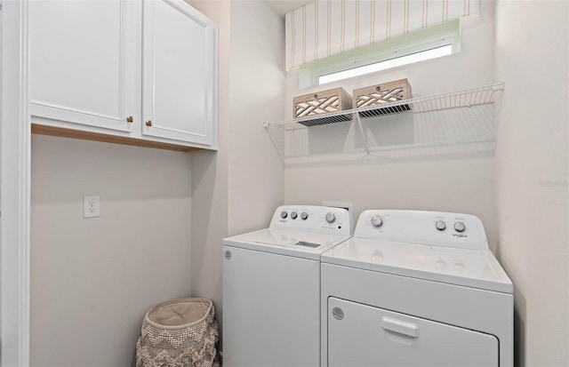 1811 Spring Shower Cir, Kissimmee, FL 34744 - laundry room featuring washing machine and clothes dryer and cabinet space