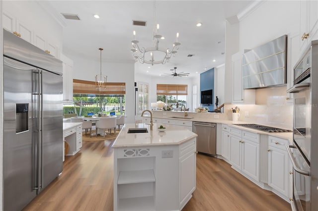 11018 Lake Butler Blvd, Windermere, FL 34786 - kitchen featuring appliances with stainless steel finishes, a chandelier, a sink, light countertops, and recessed lighting