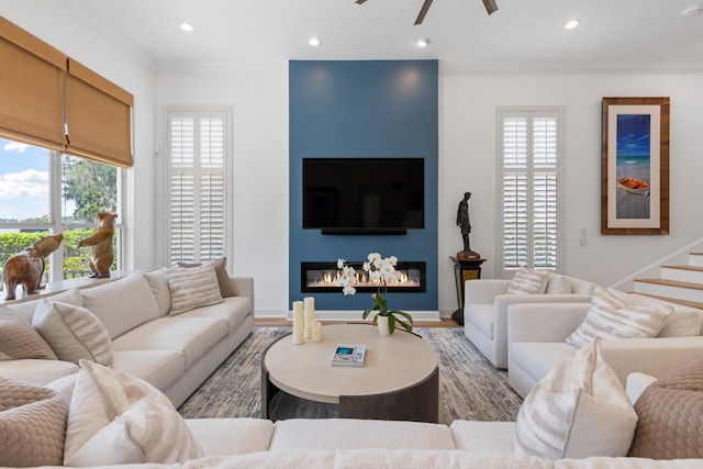 11018 Lake Butler Blvd, Windermere, FL 34786 - living room featuring a fireplace, crown molding, wood finished floors, recessed lighting, and a ceiling fan