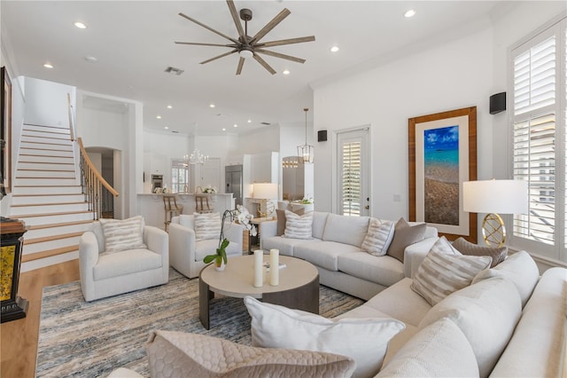 11018 Lake Butler Blvd, Windermere, FL 34786 - living room with a chandelier, stairs, wood finished floors, recessed lighting, and a ceiling fan