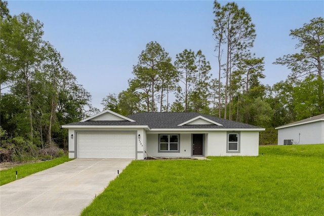9299 N Tahiti Way, Citrus Springs, FL 34433 - ranch-style house with a garage, driveway, a front yard, roof with shingles, and stucco siding