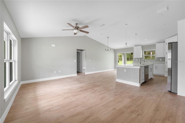 9299 N Tahiti Way, Citrus Springs, FL 34433 - kitchen with appliances with stainless steel finishes, open floor plan, vaulted ceiling, a ceiling fan, and a sink