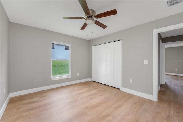 9299 N Tahiti Way, Citrus Springs, FL 34433 - unfurnished bedroom featuring light wood-type flooring and baseboards