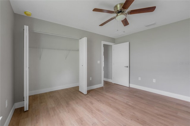 9299 N Tahiti Way, Citrus Springs, FL 34433 - unfurnished bedroom with a closet, light wood-style floors, baseboards, and ceiling fan