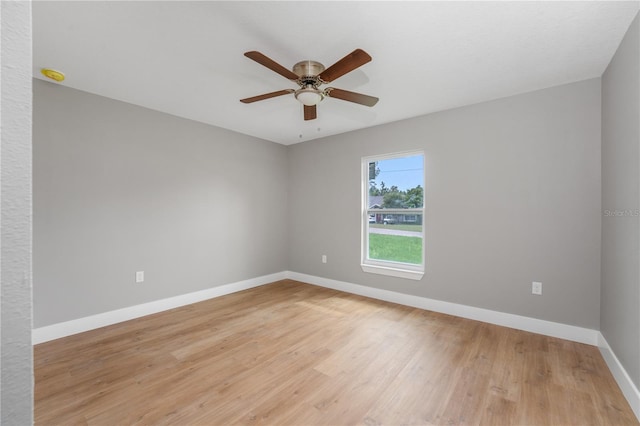 9299 N Tahiti Way, Citrus Springs, FL 34433 - empty room featuring a ceiling fan, baseboards, light wood-type flooring, and a smoke detector