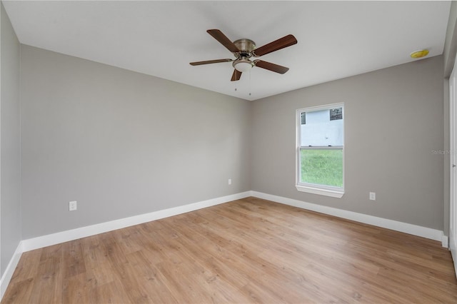9299 N Tahiti Way, Citrus Springs, FL 34433 - empty room with baseboards, ceiling fan, and light wood-style floors
