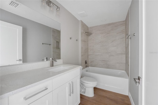 9299 N Tahiti Way, Citrus Springs, FL 34433 - full bath featuring toilet, vanity, wood finished floors, and shower / bath combination