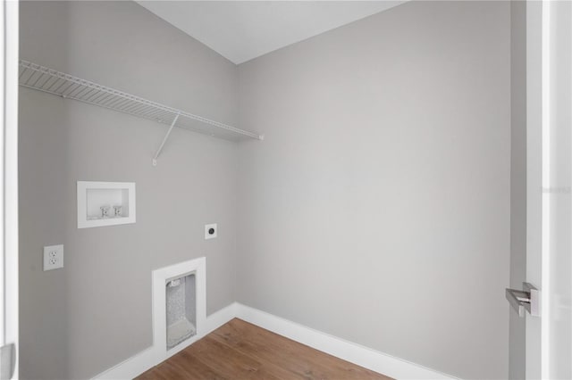 9299 N Tahiti Way, Citrus Springs, FL 34433 - laundry area featuring hookup for an electric dryer, hookup for a washing machine, wood finished floors, and baseboards