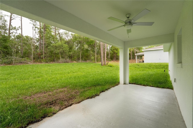 9299 N Tahiti Way, Citrus Springs, FL 34433 - view of green lawn featuring ceiling fan and a patio