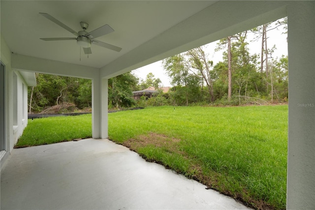 9299 N Tahiti Way, Citrus Springs, FL 34433 - view of grassy yard featuring a ceiling fan and a patio area