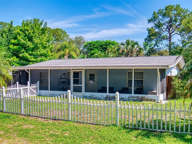 720 Meadow St, Sanford, FL 32773 - rear view of house featuring a sunroom and concrete block siding