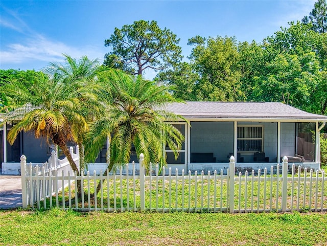 720 Meadow St, Sanford, FL 32773 - view of front of home with a sunroom