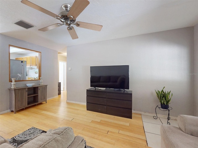 720 Meadow St, Sanford, FL 32773 - living room featuring ceiling fan and wood finished floors