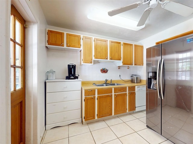 720 Meadow St, Sanford, FL 32773 - kitchen with stainless steel fridge with ice dispenser, white dishwasher, light countertops, and plenty of natural light