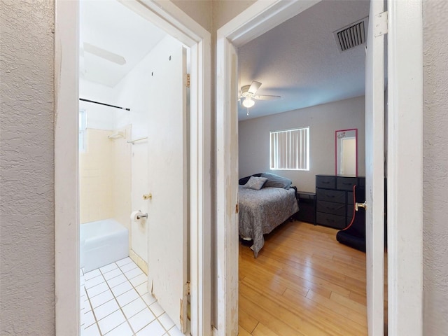 720 Meadow St, Sanford, FL 32773 - bedroom featuring ceiling fan and a textured wall