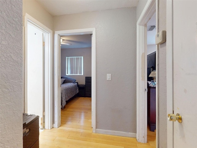 720 Meadow St, Sanford, FL 32773 - hallway with light wood finished floors and a textured wall
