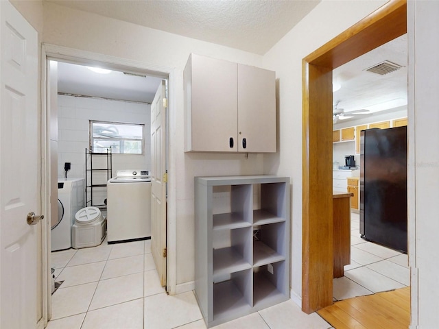 720 Meadow St, Sanford, FL 32773 - corridor featuring washer / clothes dryer and light tile patterned floors