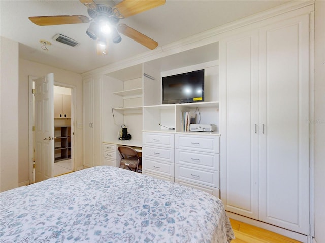 720 Meadow St, Sanford, FL 32773 - bedroom featuring built in desk and a ceiling fan
