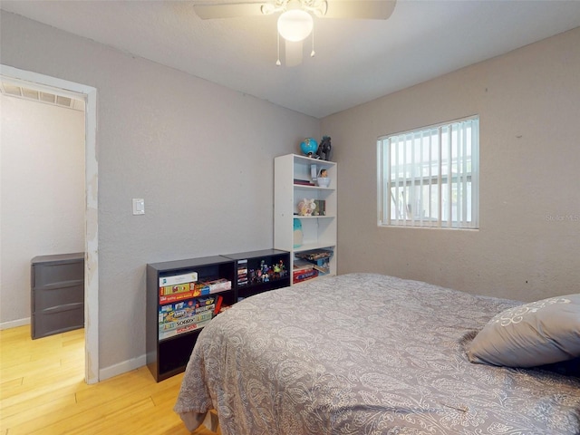 720 Meadow St, Sanford, FL 32773 - bedroom with wood finished floors and ceiling fan