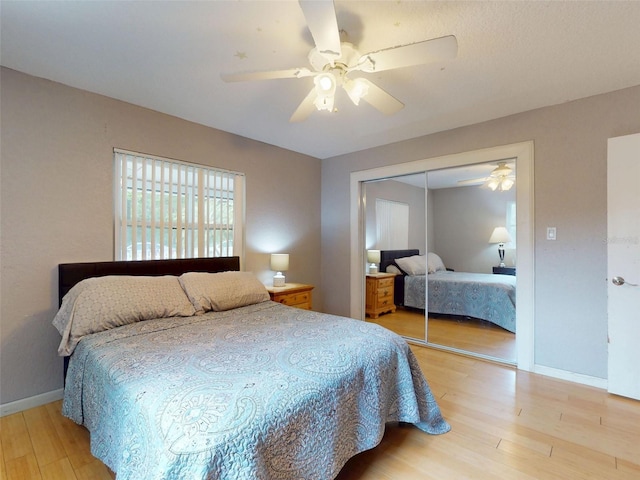 720 Meadow St, Sanford, FL 32773 - bedroom with light wood-style floors, a closet, and a ceiling fan