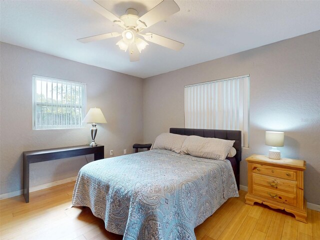 720 Meadow St, Sanford, FL 32773 - bedroom with light wood-style floors and ceiling fan