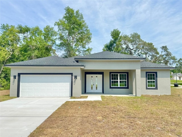 10333 N Halsey Way, Citrus Springs, FL 34434 - view of front facade featuring a garage, a front lawn, driveway, and stucco siding