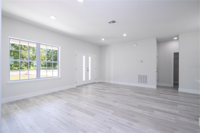 10333 N Halsey Way, Citrus Springs, FL 34434 - unfurnished living room featuring recessed lighting, light wood-style floors, and baseboards