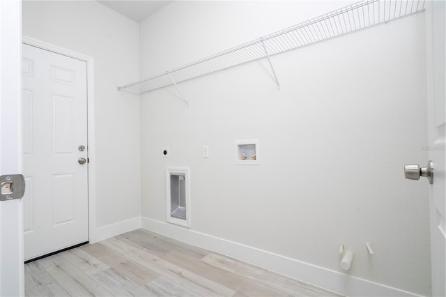 10333 N Halsey Way, Citrus Springs, FL 34434 - laundry area featuring light wood-style flooring, hookup for a washing machine, baseboards, and hookup for an electric dryer
