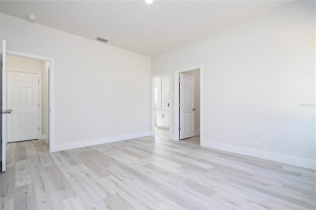 10333 N Halsey Way, Citrus Springs, FL 34434 - unfurnished room with light wood-type flooring, baseboards, and a smoke detector