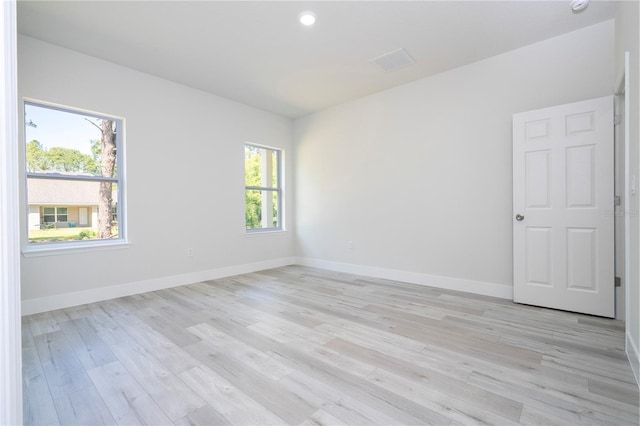 10333 N Halsey Way, Citrus Springs, FL 34434 - spare room with light wood-type flooring, baseboards, and recessed lighting