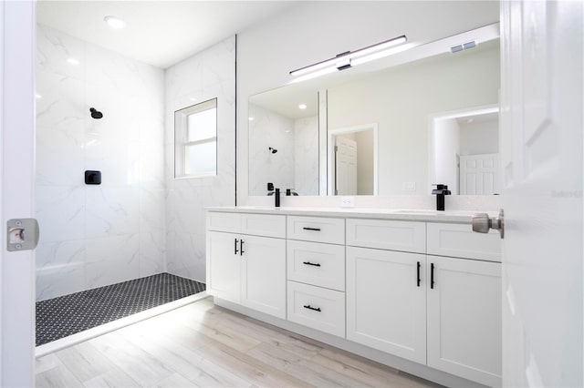 10333 N Halsey Way, Citrus Springs, FL 34434 - bathroom with double vanity, a marble finish shower, and wood finished floors