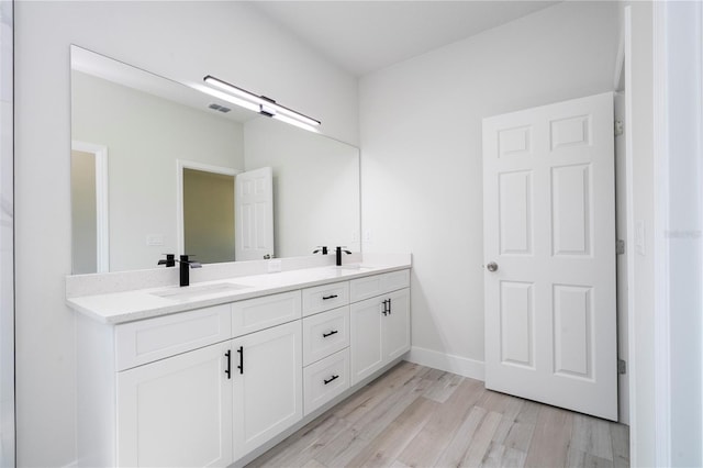 10333 N Halsey Way, Citrus Springs, FL 34434 - full bath featuring double vanity, wood finished floors, and baseboards