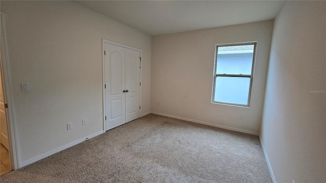 3202 Timber Hawk Cir, Ocoee, FL 34761 - unfurnished bedroom featuring carpet, baseboards, and a closet