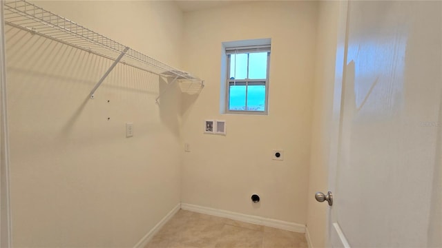 3202 Timber Hawk Cir, Ocoee, FL 34761 - laundry area featuring hookup for a washing machine, baseboards, hookup for an electric dryer, and light tile patterned floors