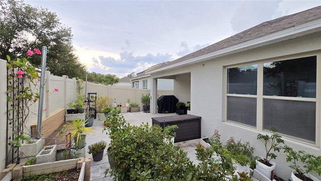 3202 Timber Hawk Cir, Ocoee, FL 34761 - fenced backyard featuring a garden, a patio, and a hot tub