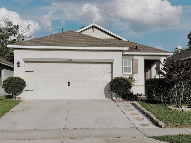 3202 Timber Hawk Cir, Ocoee, FL 34761 - single story home featuring a shingled roof, driveway, an attached garage, and stucco siding