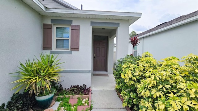3202 Timber Hawk Cir, Ocoee, FL 34761 - view of exterior entry featuring stucco siding