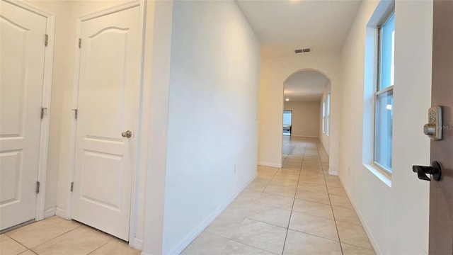 3202 Timber Hawk Cir, Ocoee, FL 34761 - corridor with arched walkways and light tile patterned floors